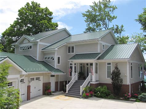 images of houses painted green with red metal roofs|houses with green roof colors.